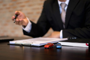 Businessmen present contract on trading - rent a car. Businessme