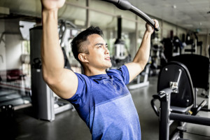 Active young man working exercise in the gym